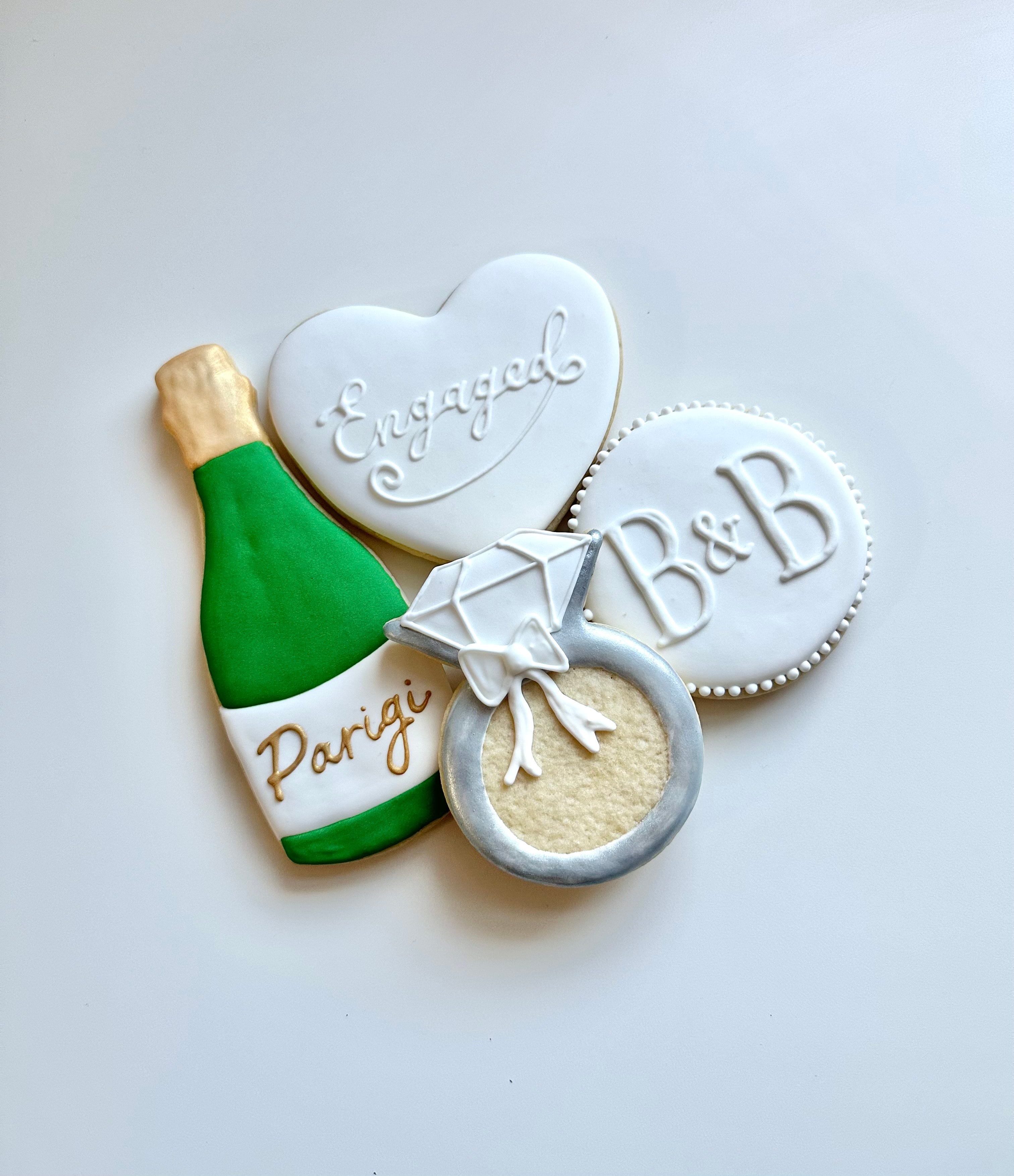 Engagement champagne and ring cookies
